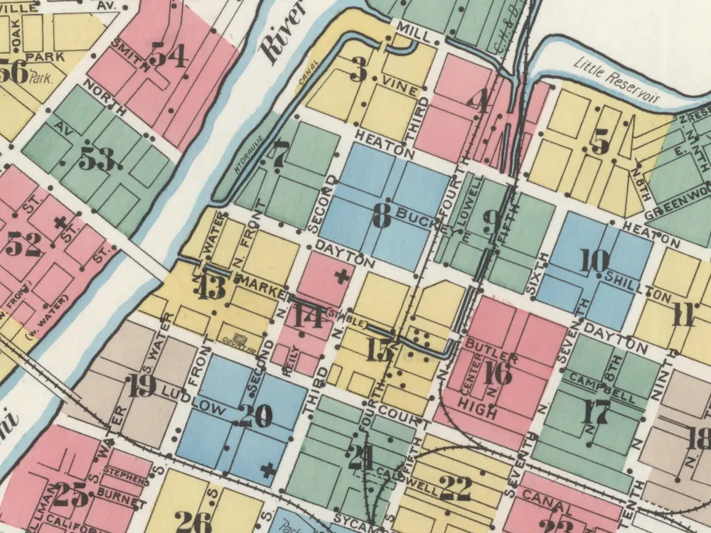1899 Sanborn fire insurance index map of downtown Hamilton, with colour-coded blocks, the Great Miami and the Hydraulic channel beside it